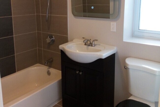 Bathroom was recently updated. - 2341 N Lorel Ave