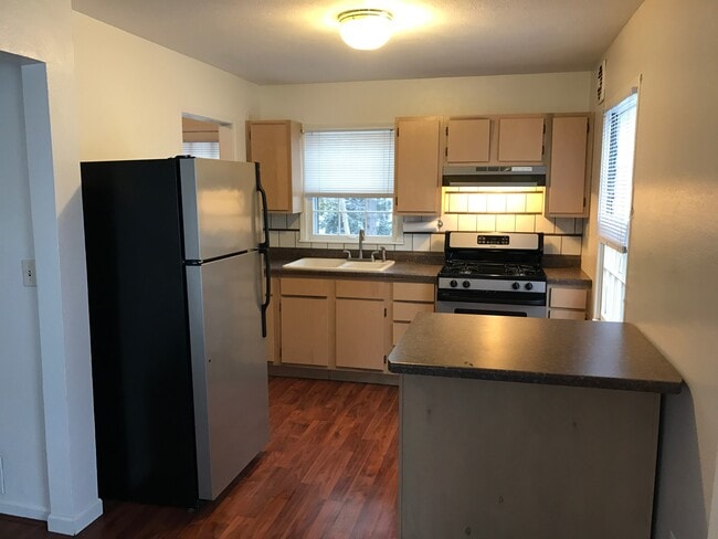 Kitchen open to living room. - 313 W Barrington Rd
