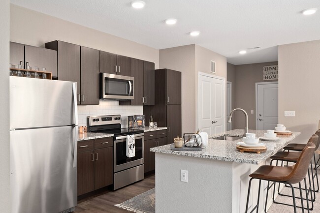 Kitchen with stainless steel appliance and island - Parq at Chesterfield