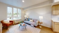 Located at 3097 SE Meek St in Milwaukie, Oregon, this one-bedroom, one-bathroom apartment offers a thoughtfully organized and efficient single-floor layout. The open-concept living, dining, and kitchen area forms the heart of the unit, maximizing the use of space while maintaining a bright, airy atmosphere. Light wood-style flooring runs throughout, lending warmth and visual continuity across the home.

The kitchen is outfitted with light maple cabinetry, white appliances including a full-size range and refrigerator, a single-basin sink, and ample counter space — providing everything needed for daily cooking. Recessed lighting illuminates the kitchen and living areas, complementing the natural light that flows in through large windows overlooking greenery outside.

The living area is generously proportioned for the unit's scale, with room for comfortable seating and a dining setup. The bedroom features a window with pleasant outdoor views, a ceiling fan, and two closets for storage.

The bathroom is clean and functional, featuring a light maple vanity with storage drawers, a full tub-shower combination, and neutral tile flooring. The overall aesthetic throughout the unit is modern and understated, with neutral wall tones and clean lines creating a calm, livable environment.