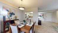 Located at 6260 Pearl Rd in Parma Heights, Ohio, this one-bedroom, one-bathroom residence offers a thoughtfully designed single-floor layout that maximizes comfort and functionality. The open-concept living and dining area is anchored by plush wall-to-wall carpeting, neutral walls, and large sliding glass doors that flood the space with natural light. A pendant light fixture highlights the dining area, which flows seamlessly into the living room — an inviting space ideal for relaxing or entertaining. The kitchen is well-equipped with white cabinetry, granite-style countertops, white appliances including an electric range and refrigerator, and durable wood-look flooring, offering both style and practicality. A pass-through window connects the kitchen to the dining area, enhancing the open feel. The generously sized primary bedroom features a tray ceiling detail, soft carpeting, and a window dressed with vertical blinds, creating a calm and restful retreat. The full bathroom includes a tiled shower-tub combination with chrome fixtures. A hallway connects the rooms efficiently, completing this well-organized and comfortable single-floor home.