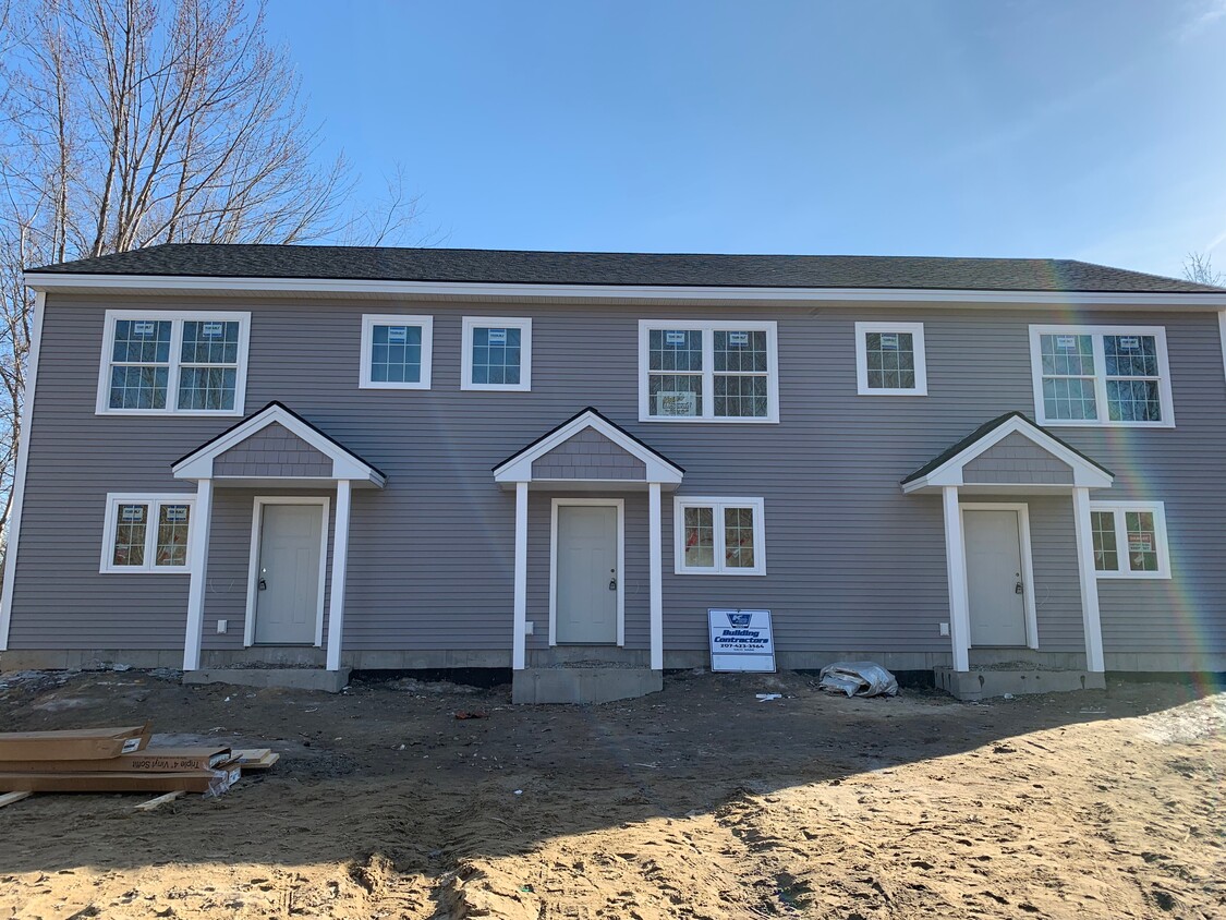 Outside area is complete with paved parking, landscaping and back yard - 94 Lincoln St