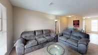 This single-story, 2-bedroom, 1-bathroom unit offers a practical and comfortable floor plan designed to maximize everyday livability. The living room serves as the central gathering space, featuring plush carpet flooring, a textured ceiling, and ample room for seating, creating a relaxed and welcoming atmosphere. Adjacent to the living area, the dining space accommodates a full-sized dining table and flows naturally toward the kitchen, making it ideal for everyday meals and entertaining.

The galley-style kitchen is efficiently designed with white cabinetry, dark countertops, and black appliances, including an electric range and dishwasher. A tall, narrow window positioned at the center of the kitchen brings in natural light and adds an airy feel to the space. Durable wood-look flooring runs throughout the kitchen, providing both style and easy maintenance.

Both bedrooms are generously proportioned, each featuring soft carpet flooring, textured ceilings, and closet storage. One bedroom includes a window that invites natural light, while the other offers a more private setting. The shared full bathroom is conveniently located and features wood-look flooring, a shower/tub combination, and a clean, functional layout. Overall, the unit provides a straightforward and efficient living environment well-suited for a variety of residents.