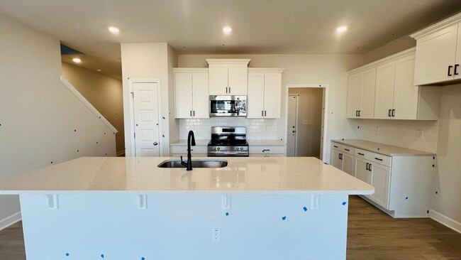 Building Photo - BRAND NEW & Beautiful Townhome with 2 car ...