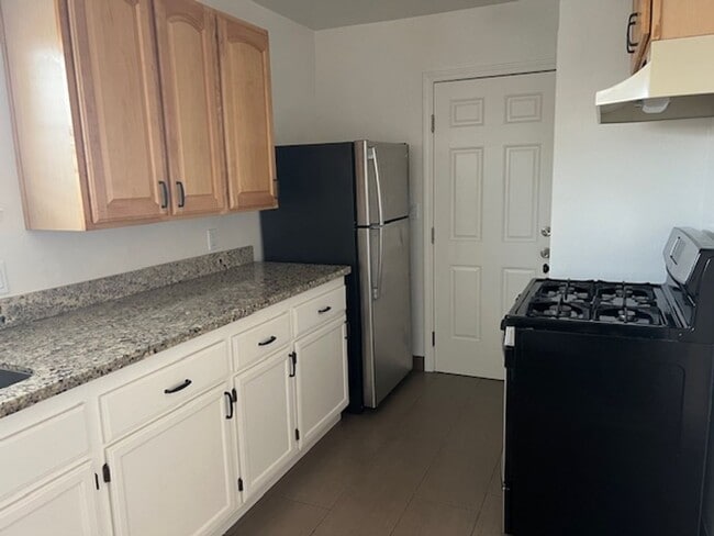 Building Photo - SEPARATE CHARMING COTTAGE / single family house, set off the street, in the back of the property.