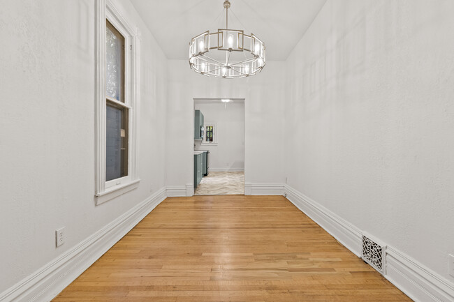 Dining area with stylish, new chandelier. - 2925 Holmes St