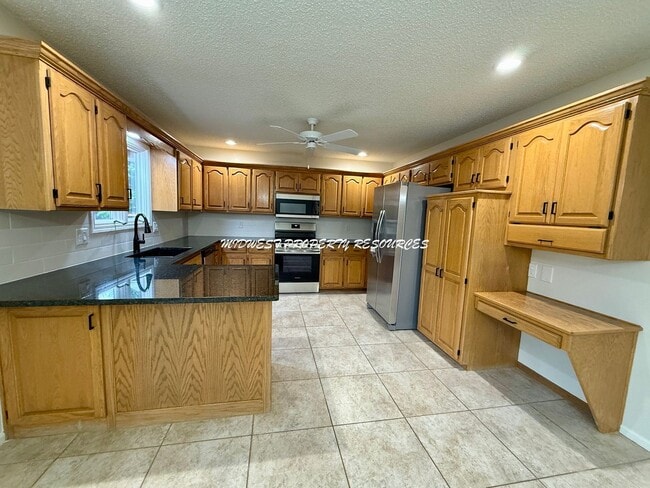 Building Photo - Spacious 3 Bedroom Home with Finished Basement, Covered Deck & Fenced Yard