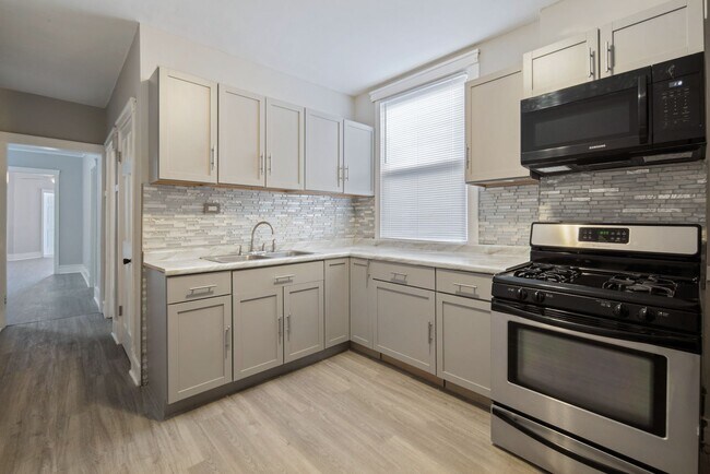 Building Photo - 6647 South Hartwell Avenue, Unit 2 - 6649