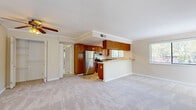Located at 2520 Ryan Court in Concord, CA, this single-floor, 2-bedroom, 3-bathroom home offers a well-organized and functional layout. The open-concept living and kitchen area forms the heart of the home, where plush neutral carpeting in the living room flows toward a raised-bar kitchen. The kitchen is equipped with stainless steel appliances, including a refrigerator and electric range, complemented by rich wood cabinetry, granite countertops, tile flooring, and track lighting overhead. Multiple windows allow natural light to brighten the space throughout the day. Crown molding adds a refined touch across the main living areas. The primary bedroom is a comfortable retreat, featuring a ceiling fan with light fixture, a large window with outdoor views, and generous closet space. The second bedroom is equally bright, with large windows overlooking greenery. Each of the three bathrooms is finished with granite vanity countertops, wood cabinetry, and clean white tile flooring. One bathroom includes a glass-door shower stall. The home's consistent use of neutral tones, crown molding, and quality finishes creates a cohesive and inviting ambiance throughout.