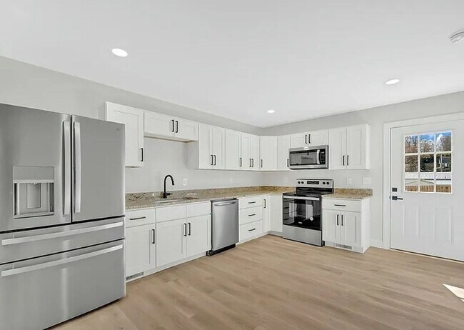 Building Photo - New 4BR/3.5BA Townhome in Meadowview – Modern Living in a Peaceful Historic Setting Near Emory & ...