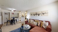 Located at 4010 Mann Village St in Indianapolis, IN, this two-bedroom, one-bathroom unit offers a well-organized single-floor layout designed for comfortable everyday living. The open living and dining area serves as the heart of the home, featuring soft carpeting, a textured ceiling, and a ceiling fan. Natural light filters in through window blinds, creating a bright and welcoming atmosphere. The space flows seamlessly into a dining nook, providing a practical setup for meals and entertaining.

The kitchen is efficiently laid out with ample cabinetry featuring wood-toned accents, generous counter space, a double sink, and a dishwasher, making it both functional and easy to navigate.

The primary bedroom is a comfortable retreat, carpeted and filled with natural light through a large window. It includes dual closets — one with a hanging rod and another with built-in shelving — offering excellent storage. The second bedroom also features carpet and a window, making it a versatile space suitable as a guest room or home office.

The shared bathroom includes a vanity with under-sink storage, a large mirror with bright overhead lighting, and a full tub-shower combination. Throughout the unit, neutral tones and consistent finishes contribute to a cohesive and functional living environment.
