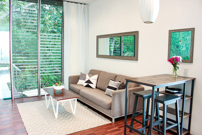 Living room looking out into the jungle - 2455 Pacific Heights Rd