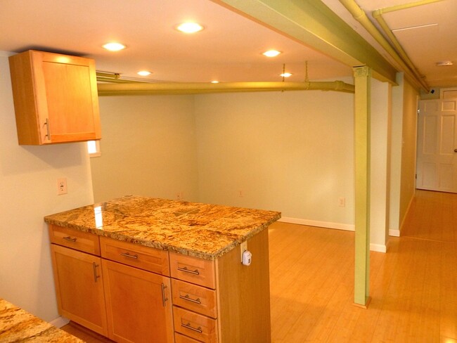 kitchen flows into open living space - 828 Emerson St NW