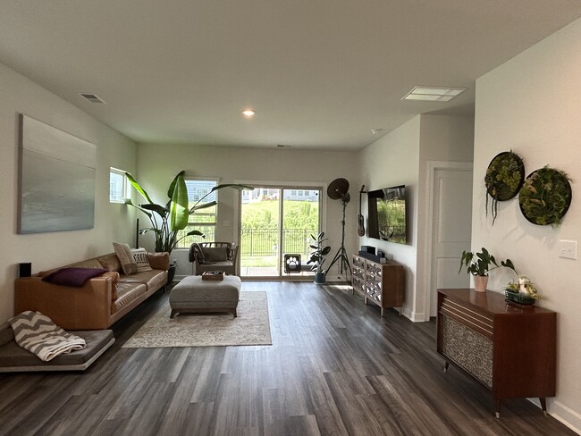 Sliding living room door leads to a covered patio - 4111 Honey Locust Dr