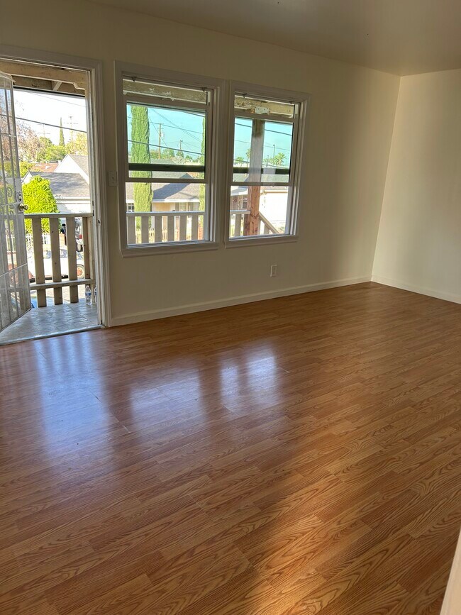 Freshly painted spacious living room with view to the mountains. - 225 E Fremont Sq