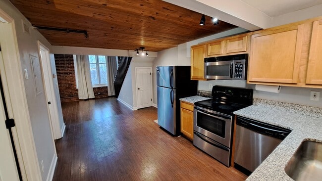 Kitchen area from front door. - 201 Hoskins Mill Ln