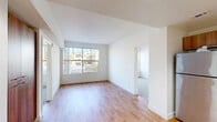 Located at 1010 Pacific Ave in the heart of Santa Cruz, CA, this 4-bedroom, 2-bathroom residence offers a well-designed single-level layout with a clean, modern aesthetic. The open living area is anchored by warm hardwood flooring and a large picture window that frames neighborhood views while flooding the space with natural light, creating a bright and welcoming atmosphere.

The kitchen is efficiently designed with rich wood cabinetry, granite countertops, and a full suite of stainless steel appliances including a refrigerator, range, microwave, and dishwasher. Hardwood flooring continues throughout the kitchen, complementing the warm tones of the cabinetry.

The four bedrooms feature plush carpeting and generously sized windows that invite ample natural light and outdoor views. The primary bedroom offers a comfortable, well-proportioned retreat. The two bathrooms are finished with hardwood flooring, granite-topped vanities, and clean white fixtures; one includes a tub-shower combination.

Throughout the residence, crisp white walls and consistent finishes create a cohesive, contemporary feel. The thoughtful layout maximizes functionality across the entire footprint, making this Santa Cruz residence a practical and attractive option in a highly desirable location.