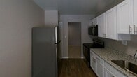 This 810 square foot apartment in Bel Air, Maryland offers a practical and efficient living space. The single-story layout includes two bedrooms, with the primary bedroom boasting a generous 170 square feet. The modern kitchen is a highlight, featuring white cabinetry, granite countertops, and stainless steel appliances. The bathroom is equipped with a shower/tub combination and modern fixtures. Ample storage is provided throughout, with multiple closets including a walk-in in one of the bedrooms. Neutral color schemes dominate the space, with beige carpeting in the bedrooms and wood-look flooring in the kitchen area. Large windows in the bedrooms and kitchen allow for natural light, enhancing the sense of space. The overall design is clean and contemporary, ideal for those seeking a low-maintenance living environment with all essential amenities in a convenient Bel Air location.