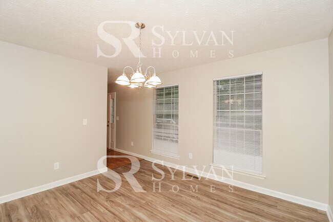 Building Photo - Fall in love with this spacious 4BR 2.5BA ...
