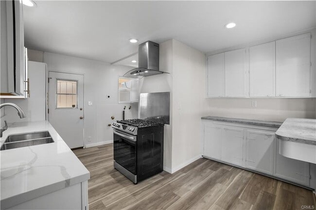 Building Photo - Welcome to this inviting 3 bedroom, 2 bath residence tucked away on a peaceful street in the hear...