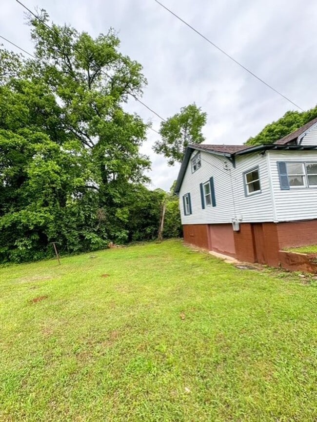Building Photo - Spacious 4-Bedroom Home with Modern Upgrad...