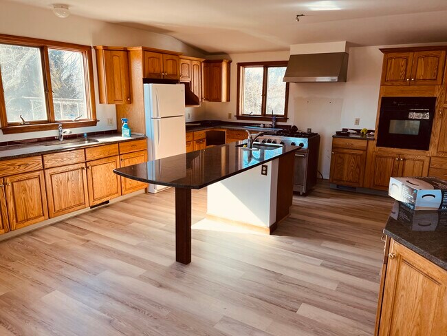 Large kitchen gas stove new floors - 200 Ten Rod Rd