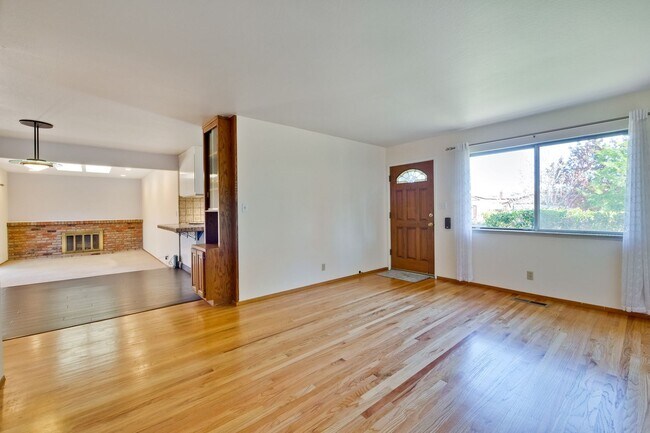 Building Photo - Newly Landscaped Backyard- Hardwood Floors...