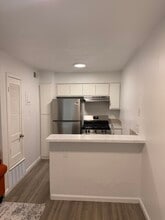 Kitchen- full size gas stove; Fridge - example (colors vary) - 305 Flats