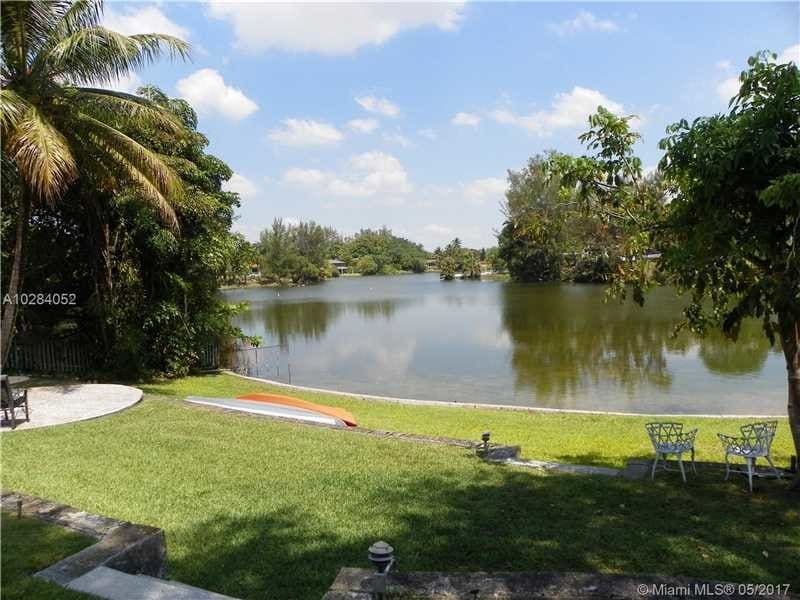 View of backyard and Lake - 6271 Coral Lake Dr