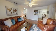 Located at 3201 W Loop 289 in Lubbock, Texas, this single-floor unit offers a well-organized layout designed for comfortable everyday living. The living room serves as the heart of the space, featuring wood-look flooring, a ceiling fan with light fixture, a textured ceiling, and a classic fireplace with a painted mantle. A sliding glass door allows natural light to filter in and provides access to the outdoors. The living area flows openly toward the dining space and kitchen, creating a connected and functional common area.

The galley-style kitchen is efficiently designed with dark espresso cabinetry lining both sides, light-toned countertops, and black appliances including a range, refrigerator, built-in microwave, and dishwasher. A stainless steel sink and overhead lighting complete the kitchen's practical layout.

The bedroom is a comfortable retreat with plush carpeting, a ceiling fan, a natural light window with curtains, and direct access to a walk-in closet offering generous storage space. The bathroom includes a full tub-shower combination, a toilet, overhead cabinetry, and wood-look flooring, maintaining a clean and functional aesthetic consistent with the rest of the unit.