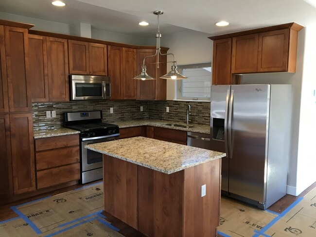 Custom cabinets, granite tops - 11625 W 62nd Pl Townhome