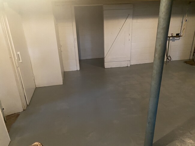 Basement- freshly painted walls and floor - 128 Standish Dr