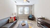 Located at 540 Selma St, Unit 302 in Savannah, GA, this well-designed residence offers a thoughtfully organized single-floor layout with multiple bedrooms, making it well-suited for shared living or family use. The open-concept kitchen is a standout feature, showcasing dark espresso cabinetry, granite countertops, black appliances including a range and refrigerator, and a spacious breakfast bar with pendant lighting overhead — ideal for both cooking and casual dining. Light wood-style flooring runs throughout the main living and kitchen areas, contributing to a clean, contemporary aesthetic. The living room is bright and welcoming, with two large windows that allow ample natural light to fill the space, complemented by a ceiling fan and light wood flooring. Multiple bedrooms offer plush carpeting, ceiling fans, and windows with natural light. Each bedroom provides comfortable proportions suitable for sleeping and study areas. The bathrooms feature light wood-style flooring, vanities with dark cabinetry, and walk-in closets, offering functional storage solutions. Throughout the unit, neutral wall tones create a calm, versatile backdrop. The overall ambiance is modern and livable, with practical finishes designed for everyday comfort in a convenient Savannah location.