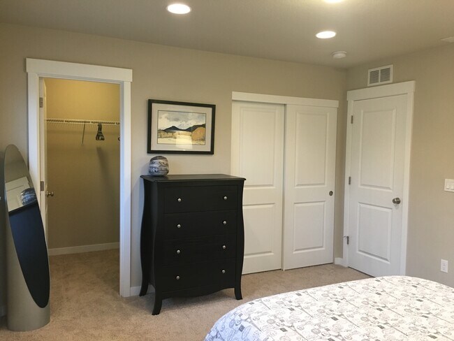 Master bedroom walk-in closet and double door closet - 14115 SW Burlwood lane