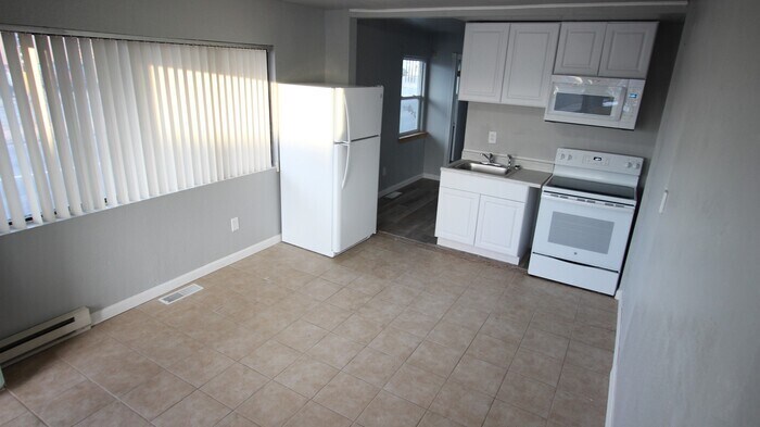 Primary Photo - Large corner unit with separate bedroom