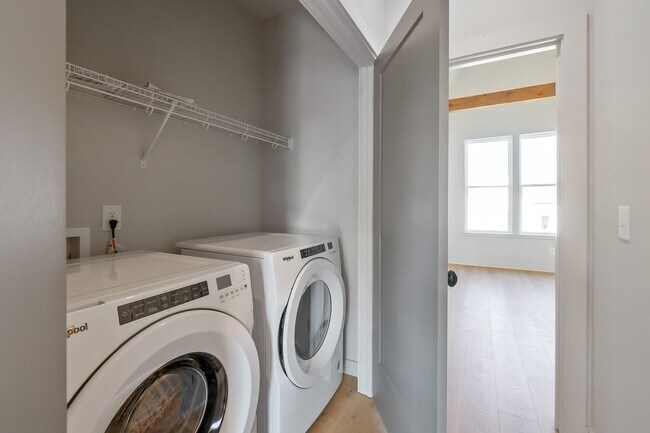 Building Photo - Captivating end unit townhome with covered...