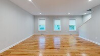 Located at 4 Laurens Dr in South Berwick, Maine, this thoughtfully designed three-floor home combines clean, modern finishes with a functional layout. Throughout the living areas, warm natural hardwood floors complement soft blue-gray walls and crisp white trim, creating a bright and inviting atmosphere. Recessed lighting adds a polished touch to the open living spaces, while windows allow natural light to flow freely through each room.

The kitchen is a standout feature, outfitted with white shaker-style cabinetry, granite countertops, and a full suite of stainless steel appliances including a gas range, over-the-range microwave, dishwasher, and refrigerator. A window above the sink brings in natural light and adds an airy feel to the space.

The bedrooms are generously proportioned with hardwood floors, neutral painted walls, and ample natural light from well-placed windows. The bathroom is finished with granite countertops, white cabinetry, a walk-in shower, and wood-look tile flooring, offering a clean and refined aesthetic.

The home also includes a spacious attached two-car garage with a Liftmaster opener and interior access, as well as additional flexible space across all three levels. A staircase connects the floors, reinforcing the home's cohesive and well-organized design throughout.