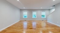 Located at 4 Laurens Dr in South Berwick, Maine, this thoughtfully designed three-floor home combines clean, modern finishes with a functional layout. Throughout the living areas, warm natural hardwood floors complement soft blue-gray walls and crisp white trim, creating a bright and inviting atmosphere. Recessed lighting adds a polished touch to the open living spaces, while windows allow natural light to flow freely through each room.

The kitchen is a standout feature, outfitted with white shaker-style cabinetry, granite countertops, and a full suite of stainless steel appliances including a gas range, over-the-range microwave, dishwasher, and refrigerator. A window above the sink brings in natural light and adds an airy feel to the space.

The bedrooms are generously proportioned with hardwood floors, neutral painted walls, and ample natural light from well-placed windows. The bathroom is finished with granite countertops, white cabinetry, a walk-in shower, and wood-look tile flooring, offering a clean and refined aesthetic.

The home also includes a spacious attached two-car garage with a Liftmaster opener and interior access, as well as additional flexible space across all three levels. A staircase connects the floors, reinforcing the home's cohesive and well-organized design throughout.