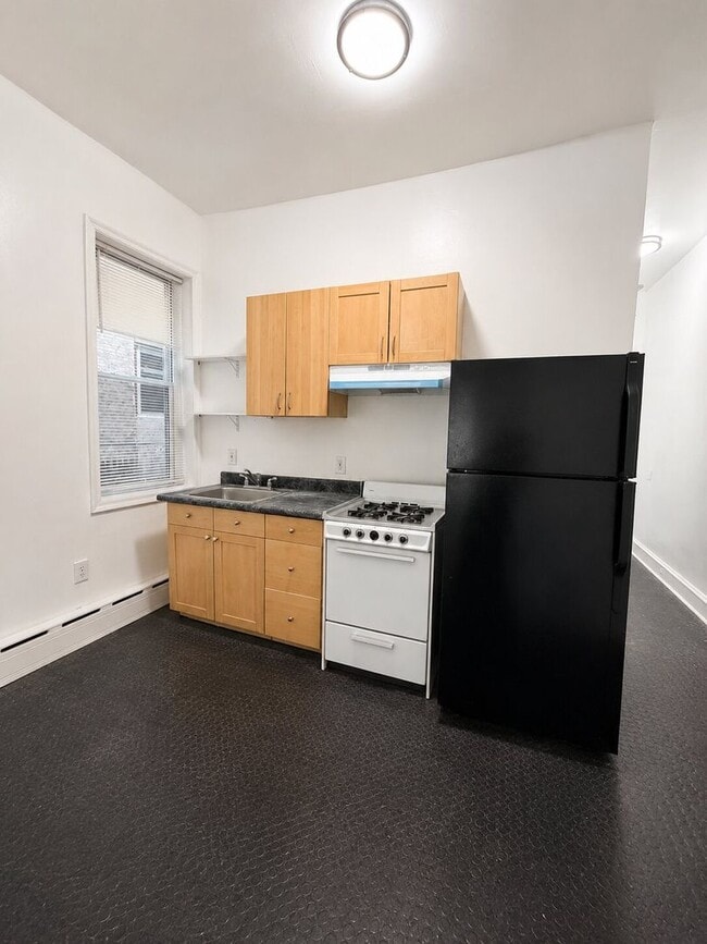 Photo - 7020 Woodland Ave Apartment