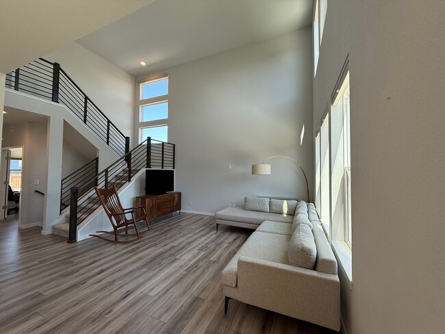 Building Photo - Stunning Luxury Living in Coal Creek with ...