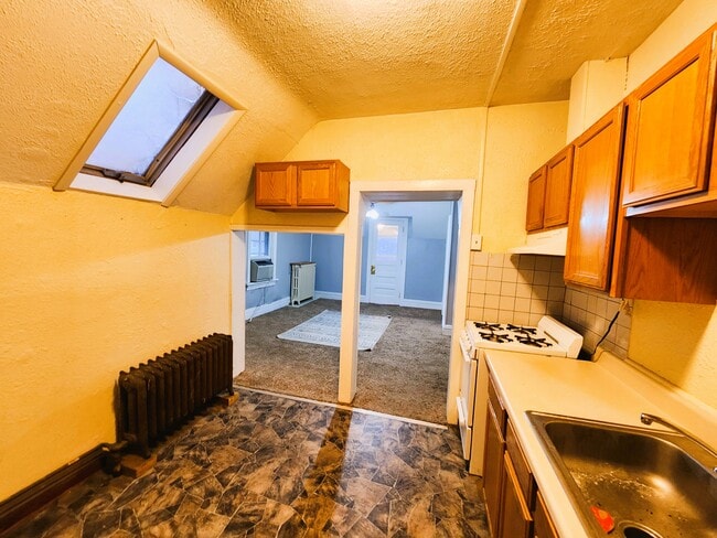 Kitchen to living room - 53 W 9th St