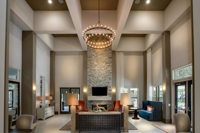 Photo of interior clubhouse with several couches and seating areas, as well as a fireplace. - Brookview at Citrus Park