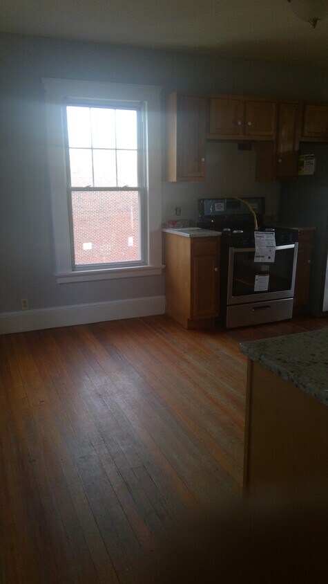 Kitchen angle from main entrance (range hood above the oven to be installed) - 435 Main St