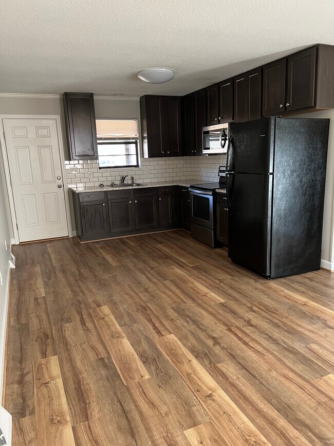 Kitchen: refrigerator, microwave, stove - 401 Tussey Rd