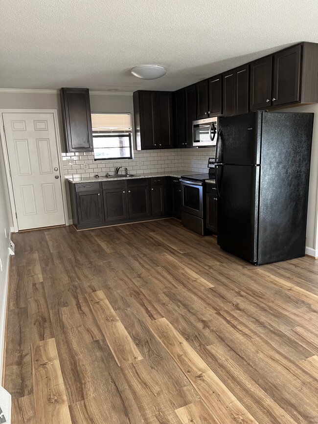 Kitchen: refrigerator, microwave, stove - 401 Tussey Rd
