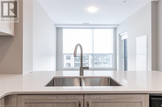 Photo du bâtiment - 104-1104 Garment St