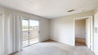 Located at 681 N Saginaw Blvd in Saginaw, TX, this single-floor residence offers a practical and comfortable layout across three bedrooms, a living room, dining room, kitchen, and a closet. The living room serves as the heart of the home, featuring a white brick-tiled fireplace, soft carpeting, a ceiling fan, and sliding glass doors that open to an outdoor balcony with neighborhood views, filling the space with natural light. Adjacent to the living area, the dining room flows seamlessly for everyday functionality. The galley-style kitchen is equipped with white cabinetry, a double-basin sink, light countertops, and wood-look vinyl flooring, providing an efficient and clean workspace. The primary bedroom is a well-proportioned retreat with sliding glass door access to the balcony and plush carpeting. The additional bedrooms each feature ceiling fans, carpet flooring, and windows that bring in natural light. One bedroom benefits from a connected bathroom. The dedicated closet space includes built-in shelving and washer/dryer hookups, adding practical utility. Neutral wall tones, textured ceilings, and consistent finishes throughout create a cohesive and move-in-ready atmosphere.