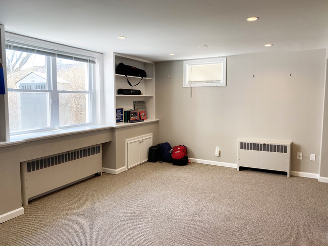 Den with ample sunlight and bookshelves - 110 Dobson St