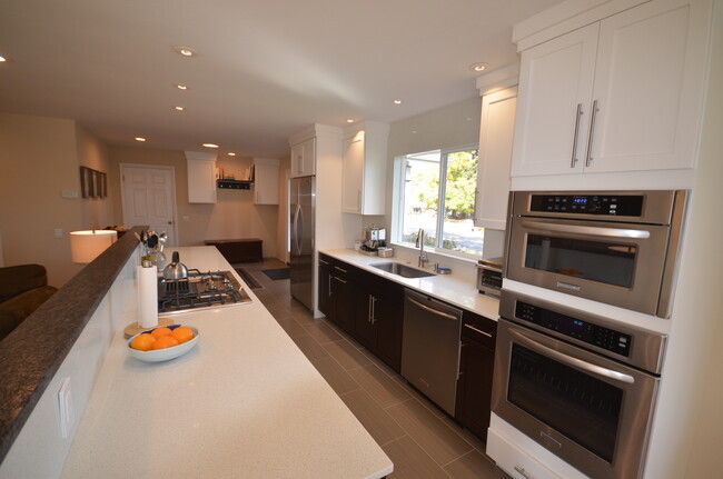 Combined kitchen, dining and living area. - 401 June St