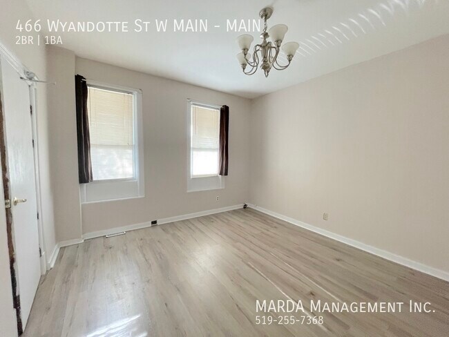 Building Photo - COZY 2 BEDROOM 1 BATH MAIN FLOOR UNIT+ 50%...